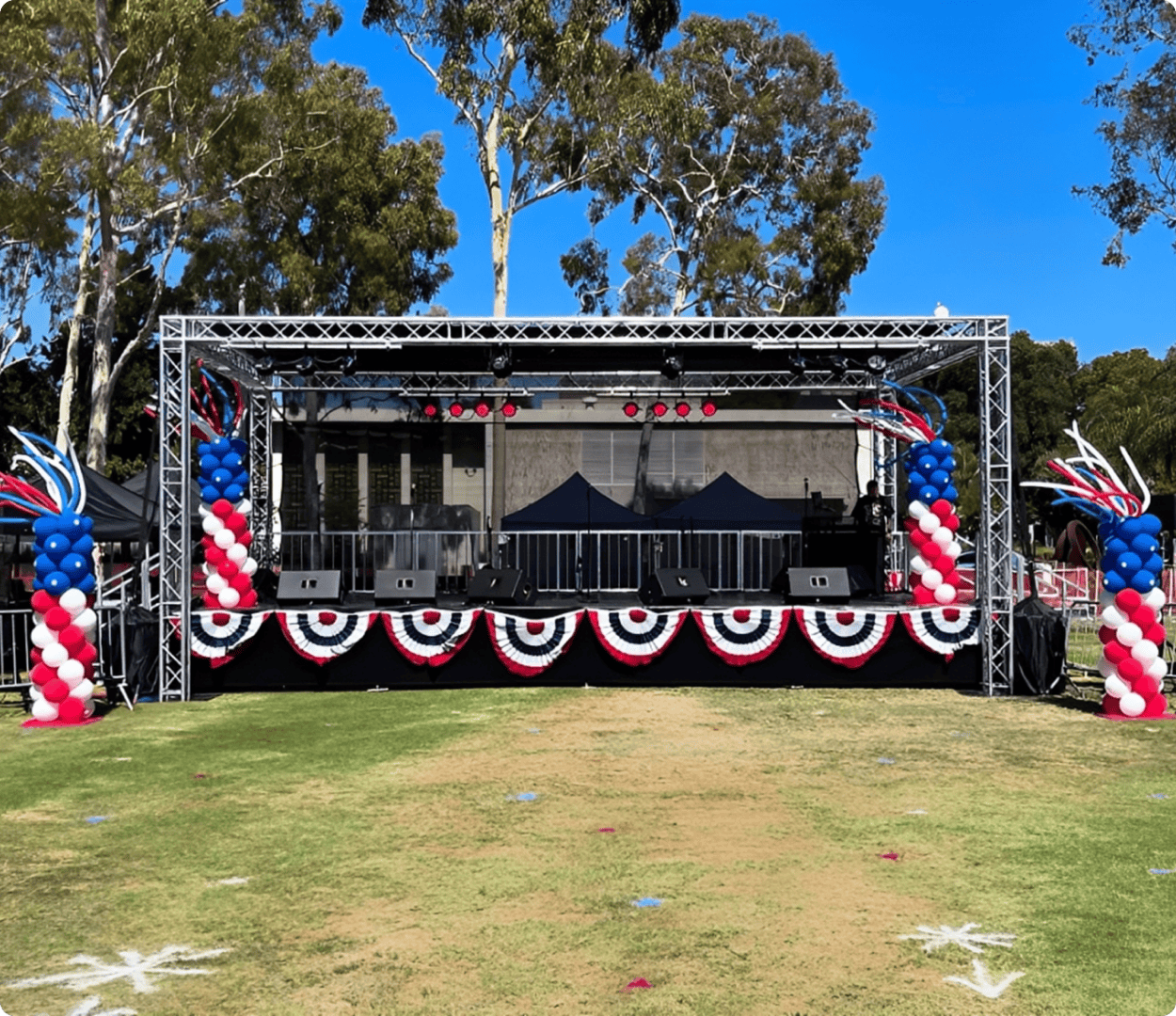 Red, white, blue balloons on stage